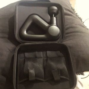 Theragun prime handheld percussive massage gun and hard case.